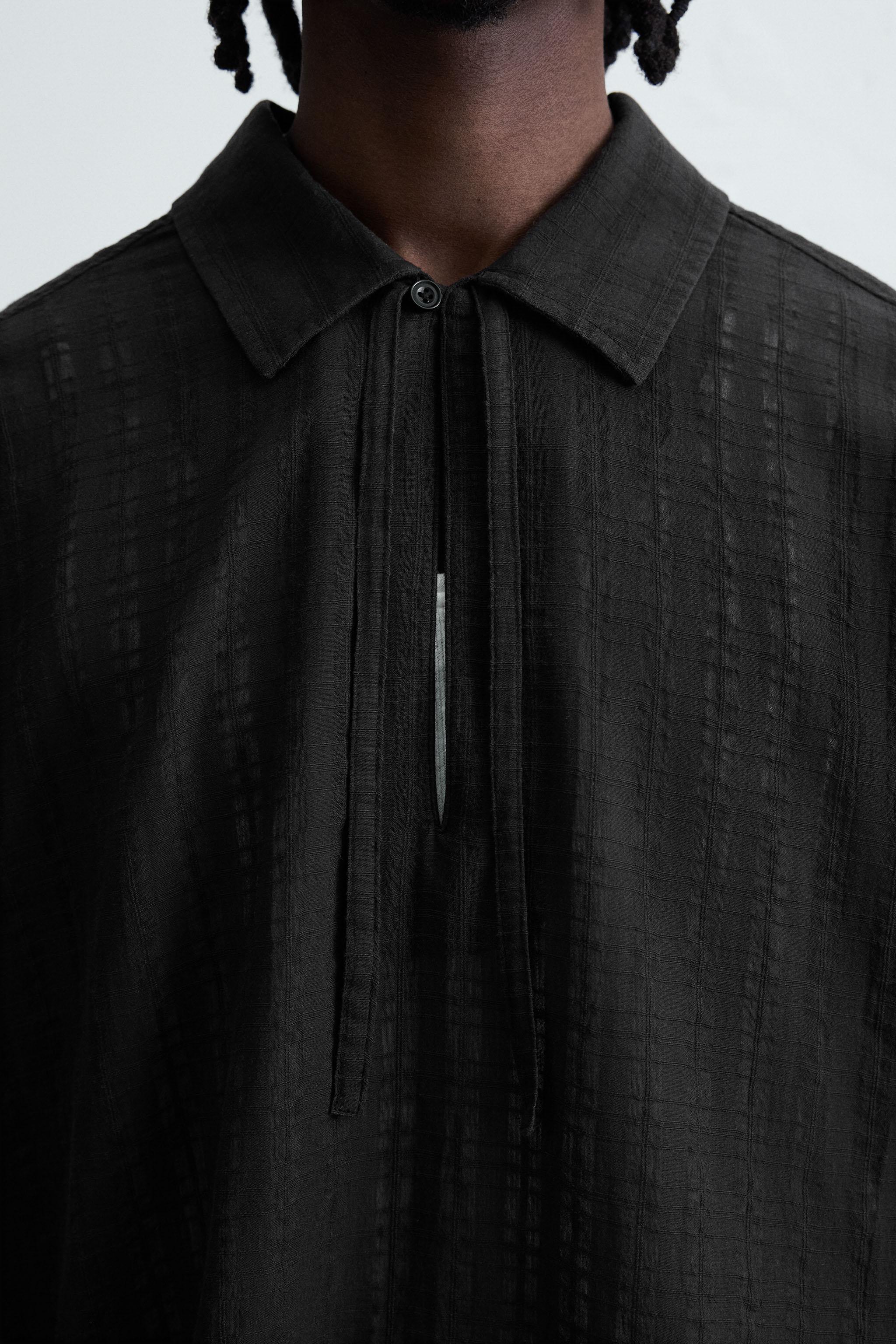 CHEMISE POLO STRUCTURÉE SEMI-TRANSPARENTE